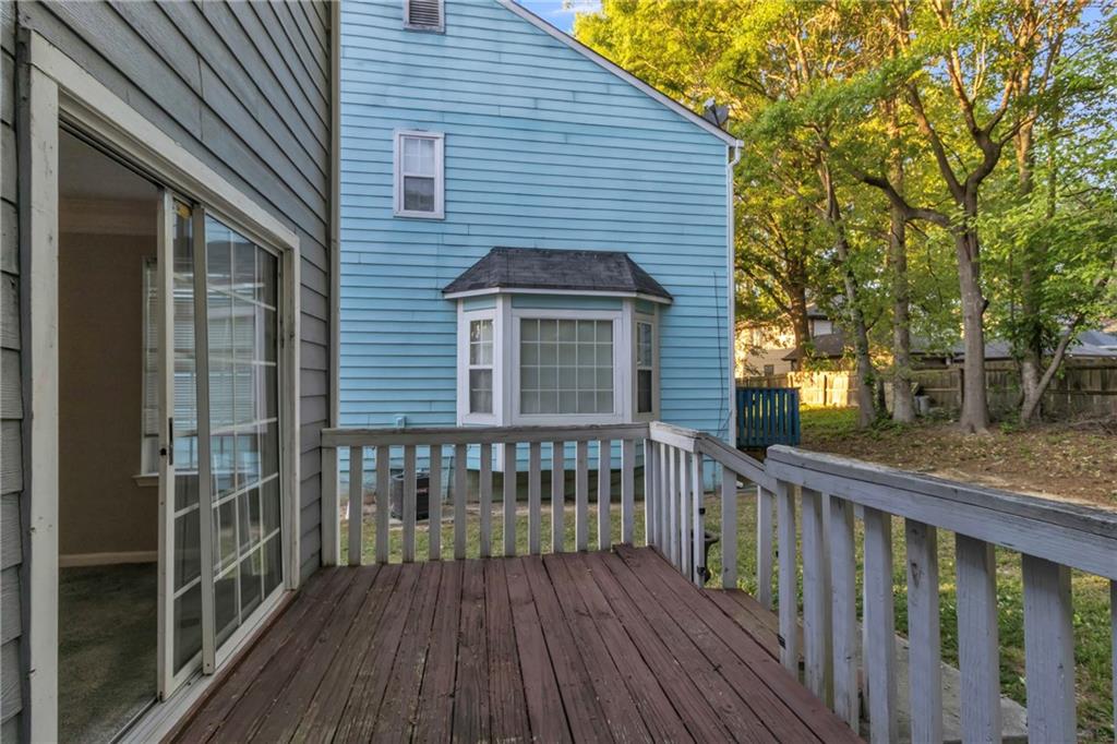 5910 Hampton Court Atlanta, GA 30349 - Photo 20 of 23 a view of wooden house with a large window