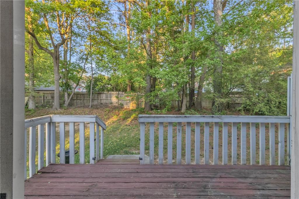 5910 Hampton Court Atlanta, GA 30349 - Photo 21 of 23 a view of a wooden deck
