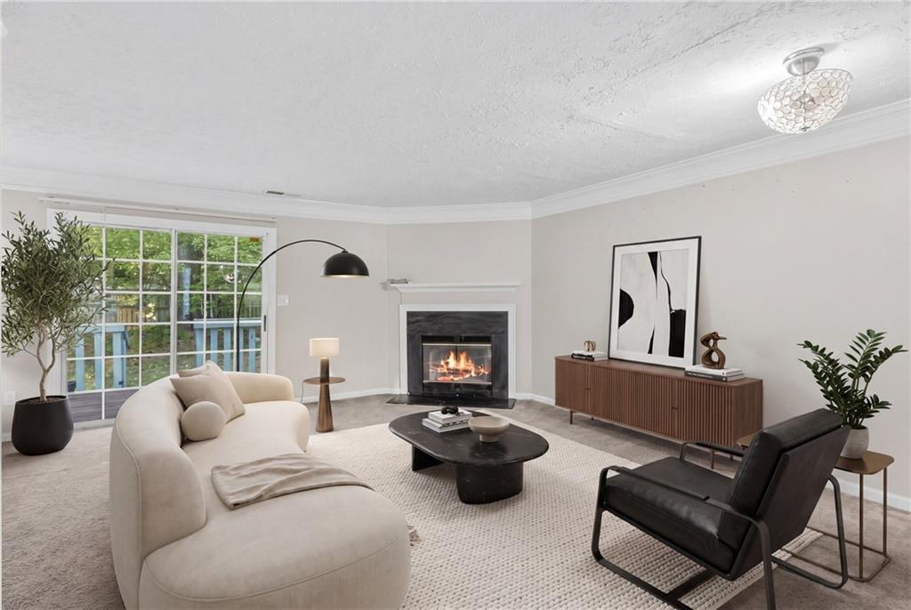 5910 Hampton Court Atlanta, GA 30349 - Photo 4 of 23 a living room with furniture and a fireplace