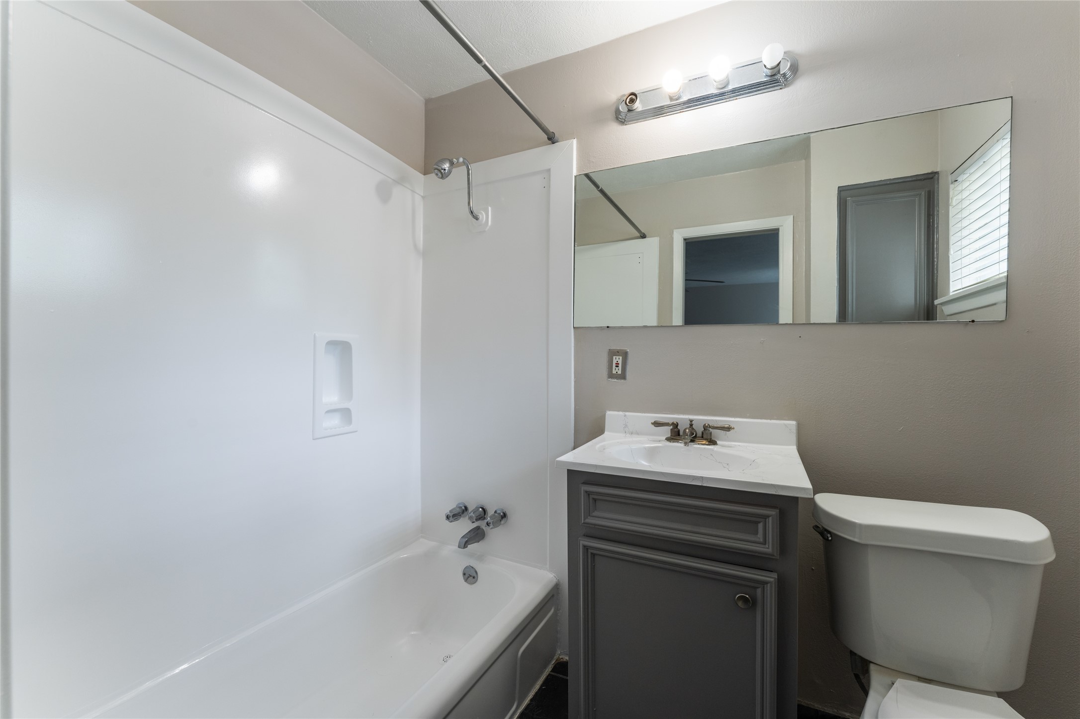 420 West Alabama Street, Unit 10 Houston, TX 77006 - Photo 4 of 9 a bathroom with a sink toilet vanity and bathtub
