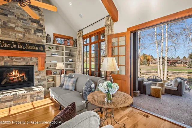 a view of a patio with couches table and chairs and garden