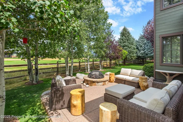 a view of a dining room with furniture wooden floor and chandelier