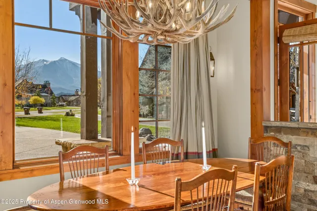 a large kitchen with stainless steel appliances granite countertop a sink and cabinets