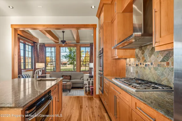 a bathroom with a sink a mirror and toilet