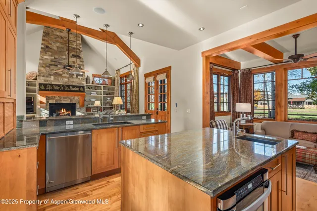 a spacious bedroom with a bed and a fireplace