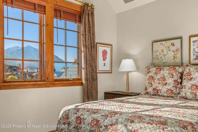 an aerial view of a house with garden space and street view