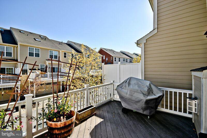 7616 Elmcrest Road Hanover, MD 21076 - Photo 28 of 30 a view of a chair and table in the balcony