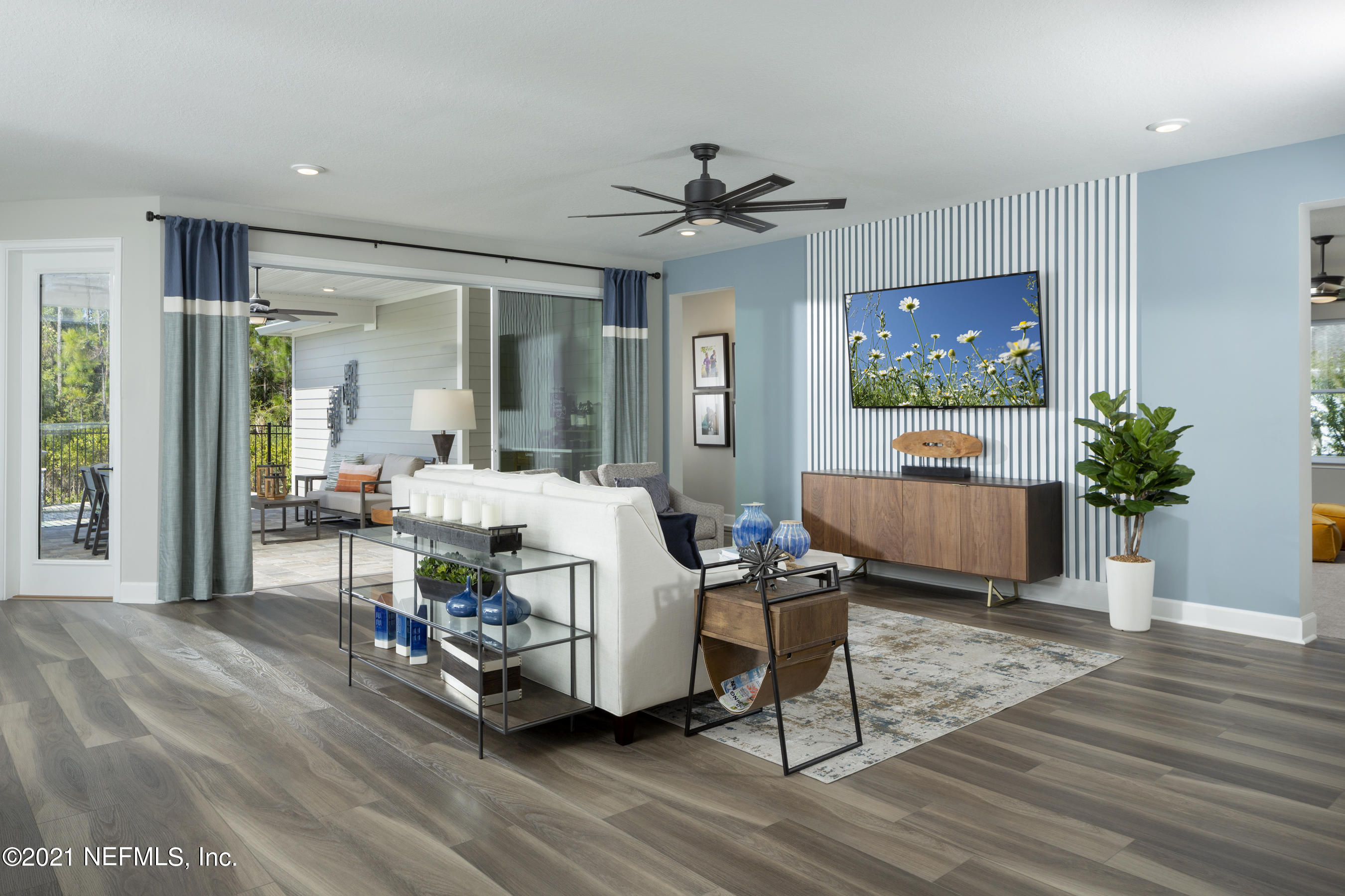 35 Windley Drive St. Augustine, FL 32092 - Photo 3 of 8 a living room with furniture and a flat screen tv