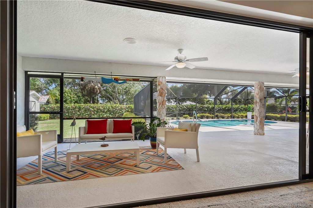 4620 Southeast Quail Trail Stuart, FL 34997 - Photo 42 of 71 a living room with large windows