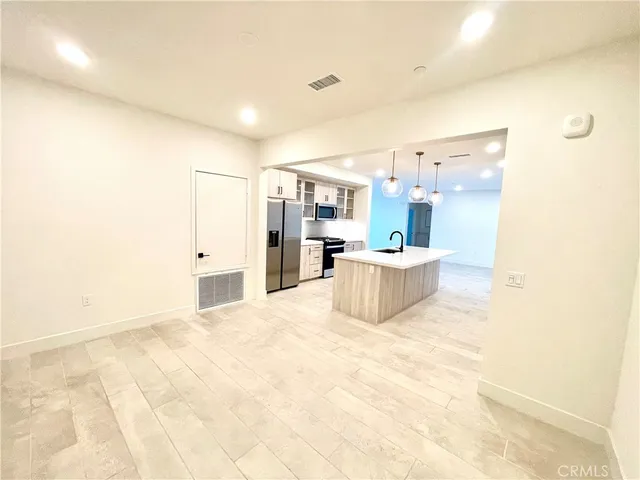 a view of a kitchen with a sink