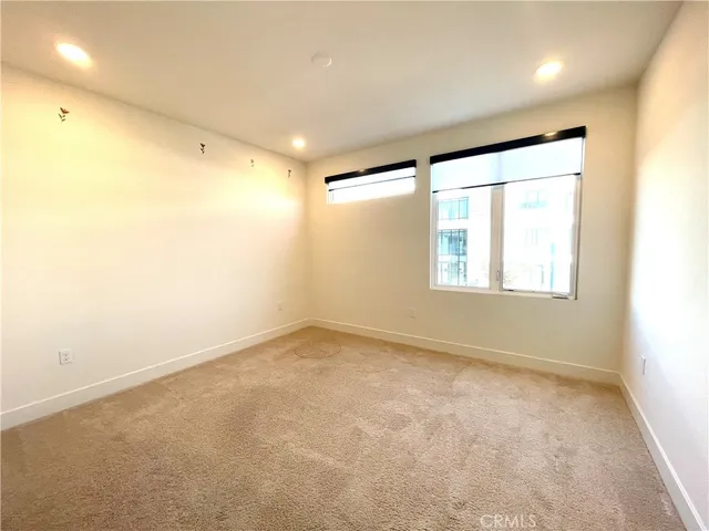 an empty room with a empty space and a window