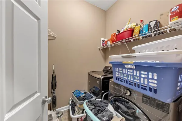 a spacious bathroom with a granite countertop tub sink and mirror