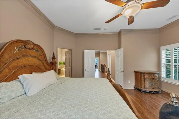 a bedroom with furniture and a window