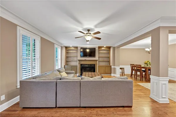 a living room with furniture fireplace and flat screen tv