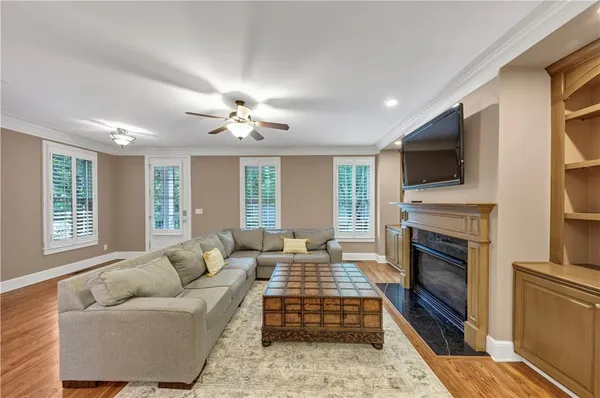 a view of a dining room with furniture and wooden floor