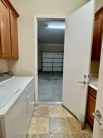 a bathroom with a vanity and a tub