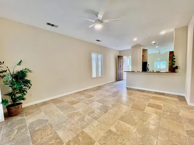 a view of a kitchen with a sink and a chandelier