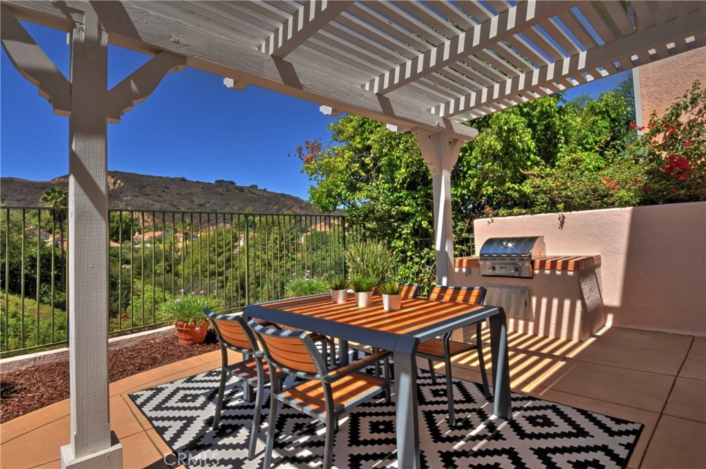 3619 Cll Joaquin Calabasas, CA 91302 - Photo 14 of 42 a view of a patio with table and chairs and potted plants