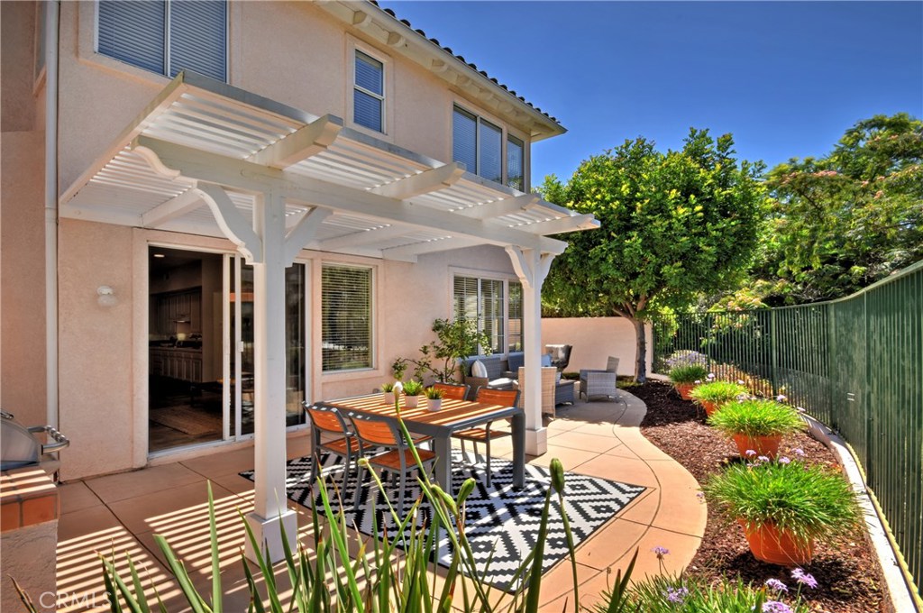 3619 Cll Joaquin Calabasas, CA 91302 - Photo 21 of 42 a view of a patio with table and chairs and potted plants