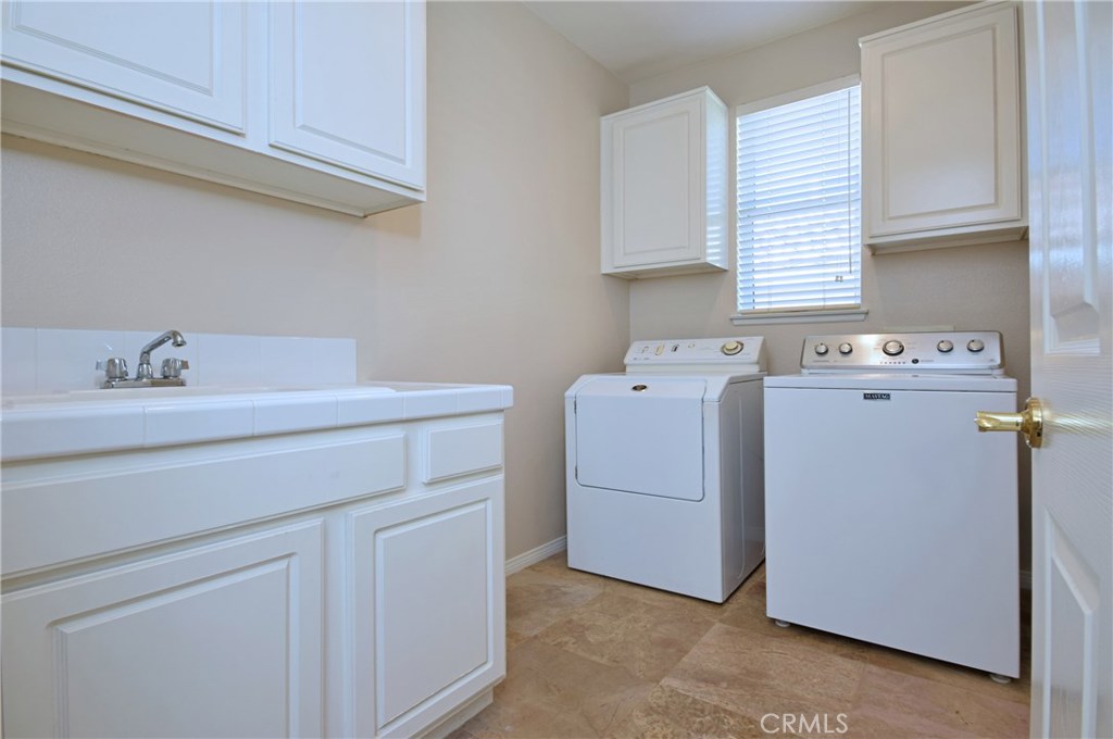 3619 Cll Joaquin Calabasas, CA 91302 - Photo 32 of 42 a utility room with dryer and washer