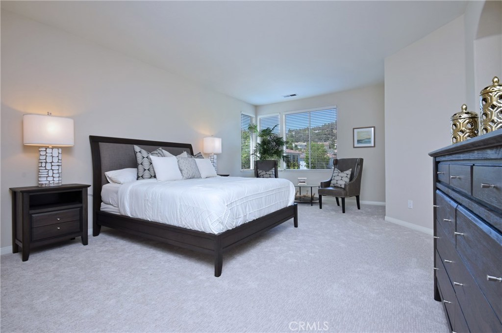 3619 Cll Joaquin Calabasas, CA 91302 - Photo 33 of 42 a large bed sitting in a room and table