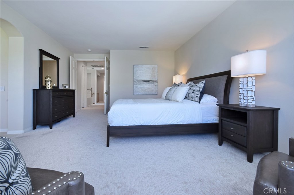 3619 Cll Joaquin Calabasas, CA 91302 - Photo 37 of 42 a bedroom with a bed and lamp on dresser