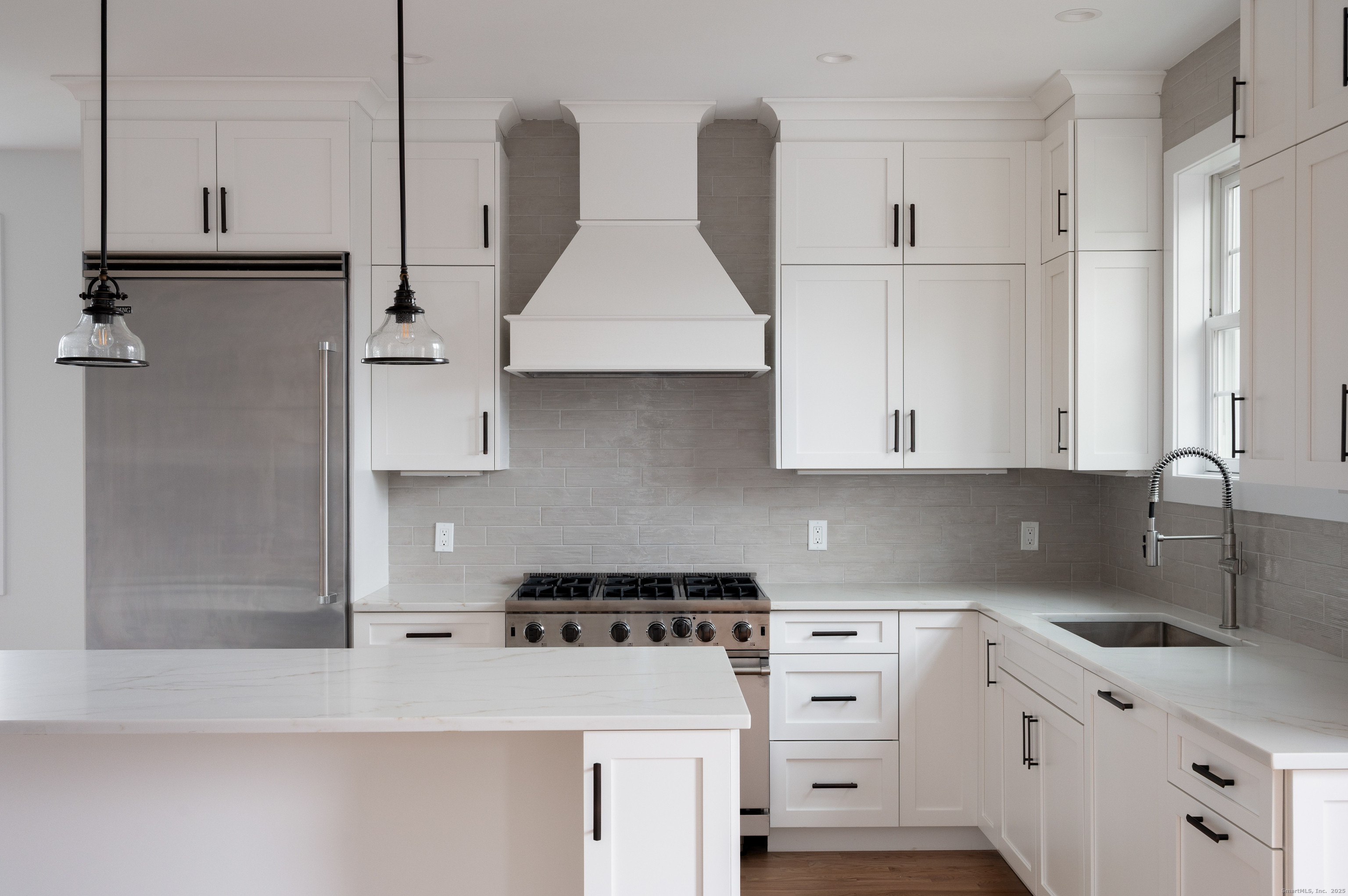 12 Walnut Ridge Court Stamford, CT 06905 - Photo 12 of 32 a kitchen with cabinets appliances and a sink