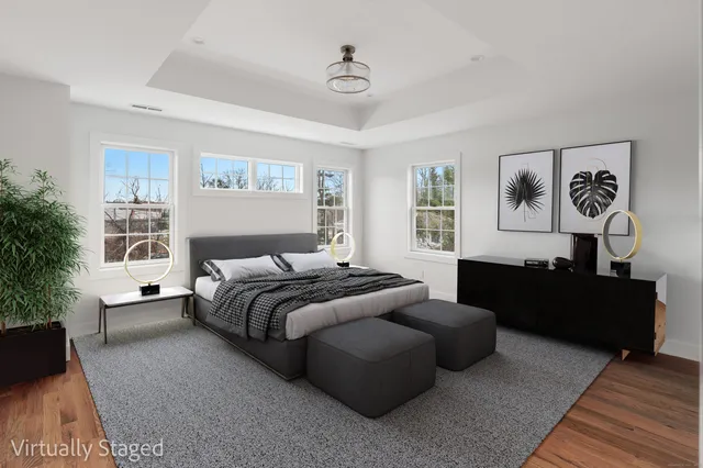 a spacious bedroom with a bed and a couch