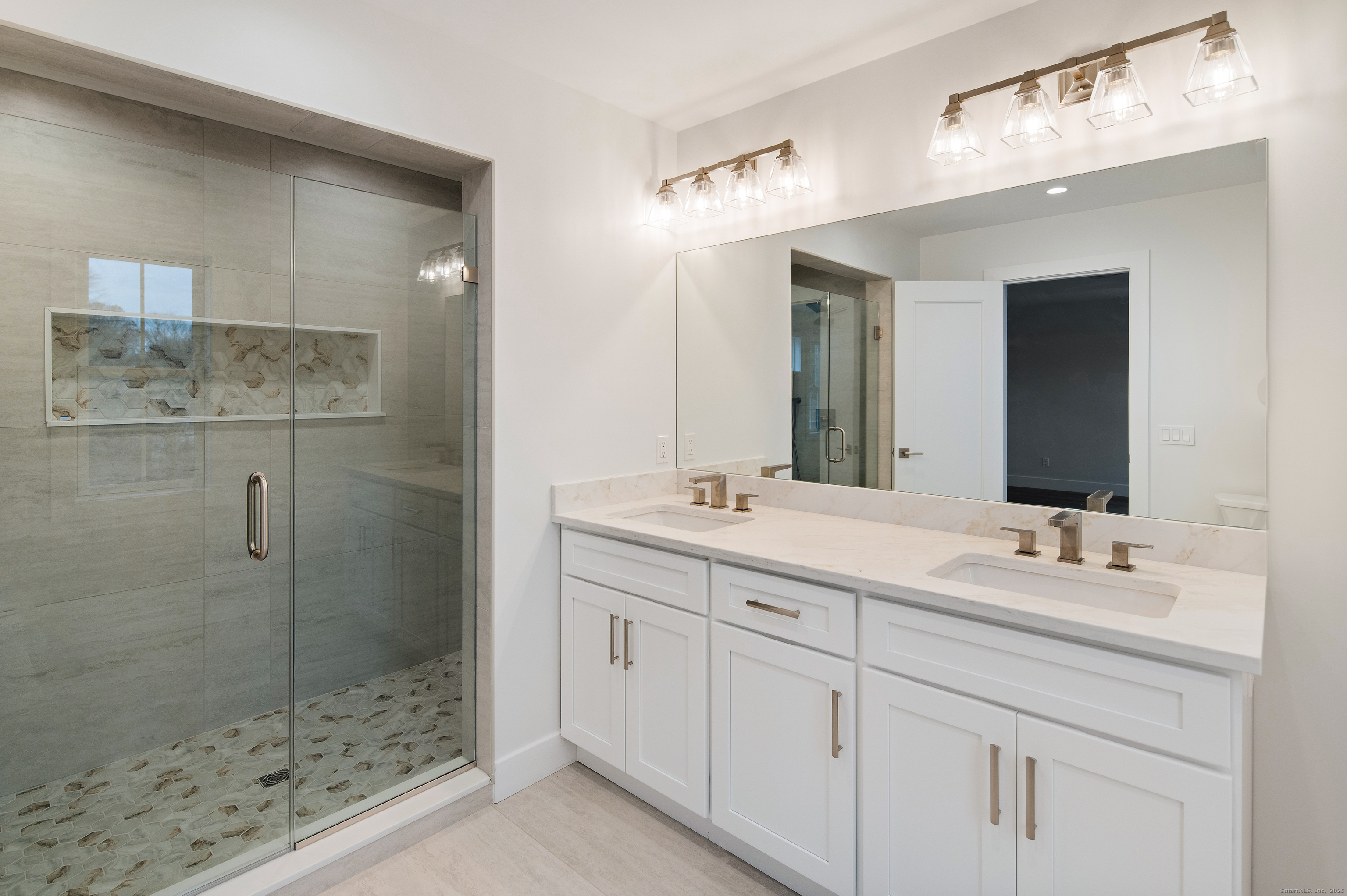 12 Walnut Ridge Court Stamford, CT 06905 - Photo 14 of 32 a bathroom with a double vanity sink mirror and shower