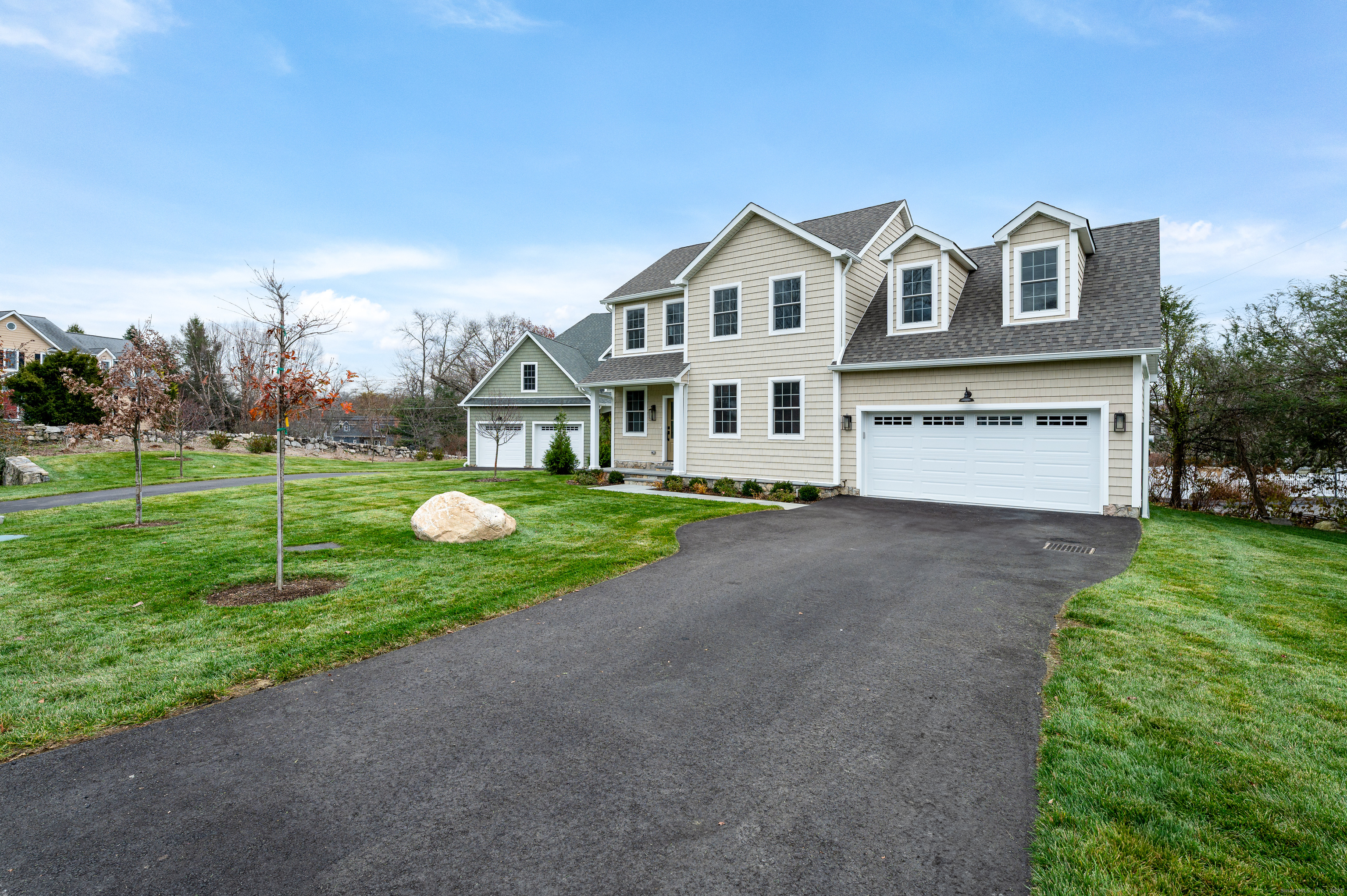 12 Walnut Ridge Court Stamford, CT 06905 - Photo 2 of 32 a front view of a house with a yard and garage