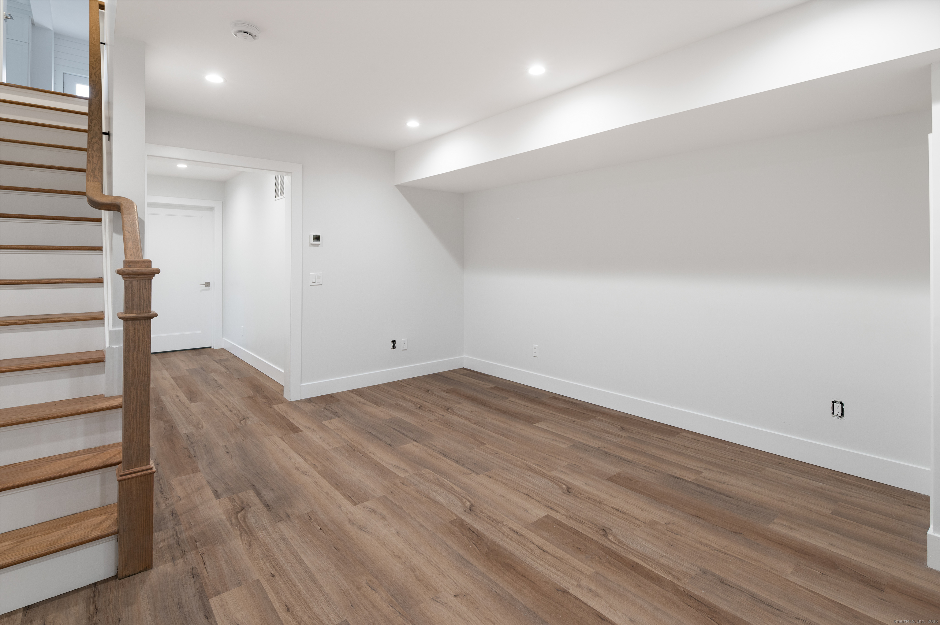 12 Walnut Ridge Court Stamford, CT 06905 - Photo 22 of 32 an empty room with wooden floor