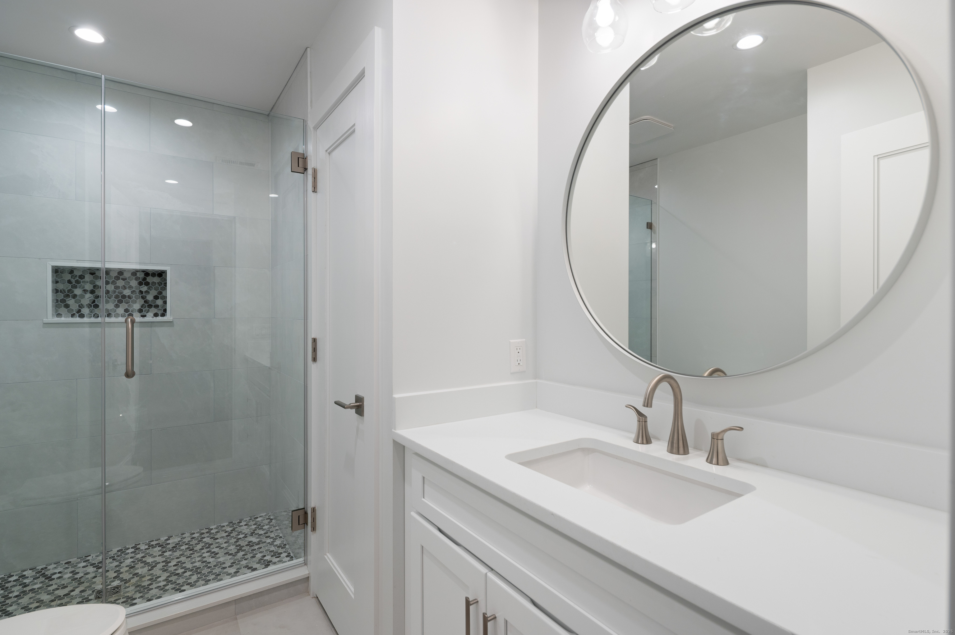 12 Walnut Ridge Court Stamford, CT 06905 - Photo 24 of 32 a bathroom with a sink and a mirror