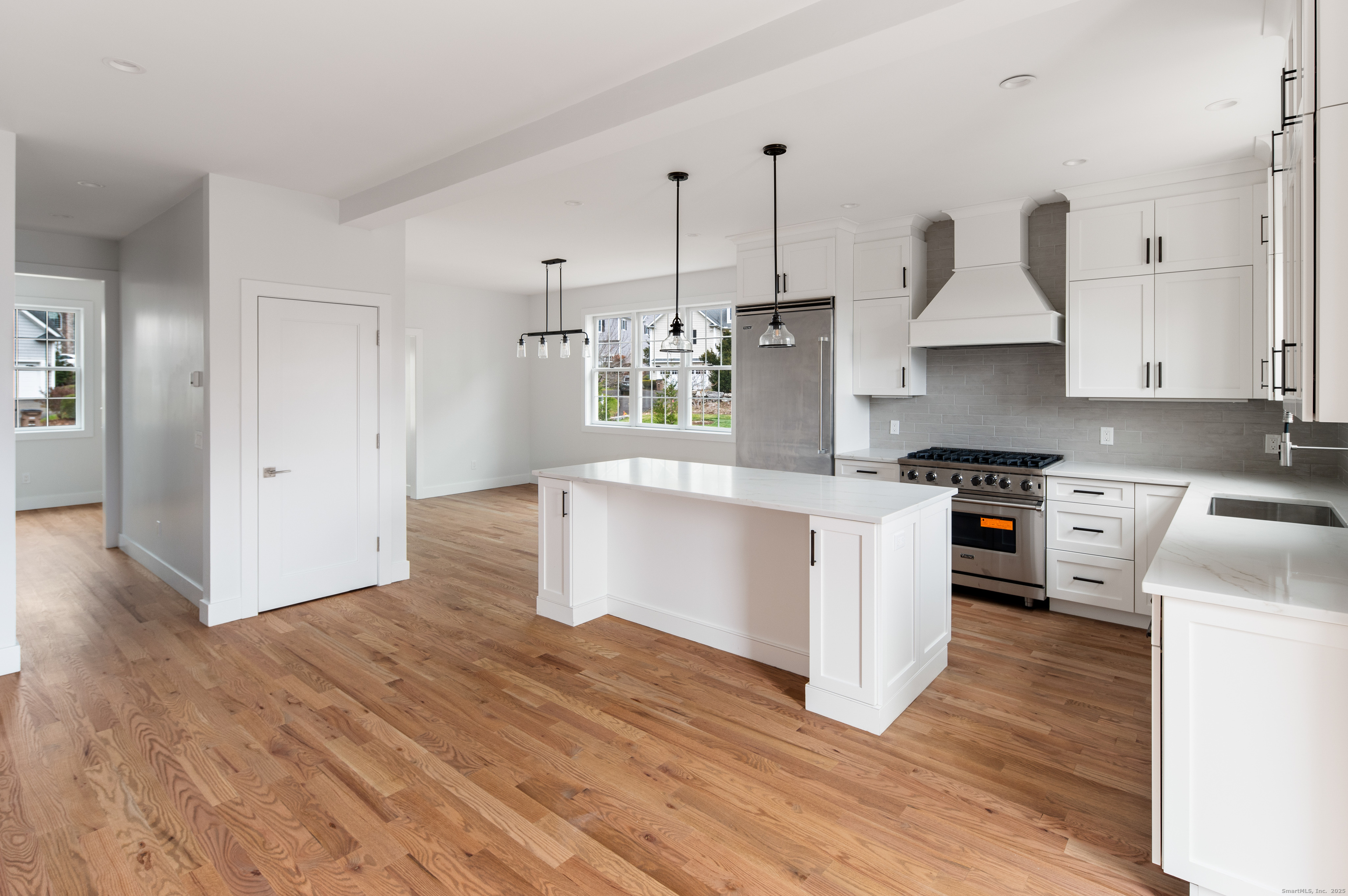 12 Walnut Ridge Court Stamford, CT 06905 - Photo 9 of 32 a kitchen with stainless steel appliances granite countertop a stove a sink and a refrigerator