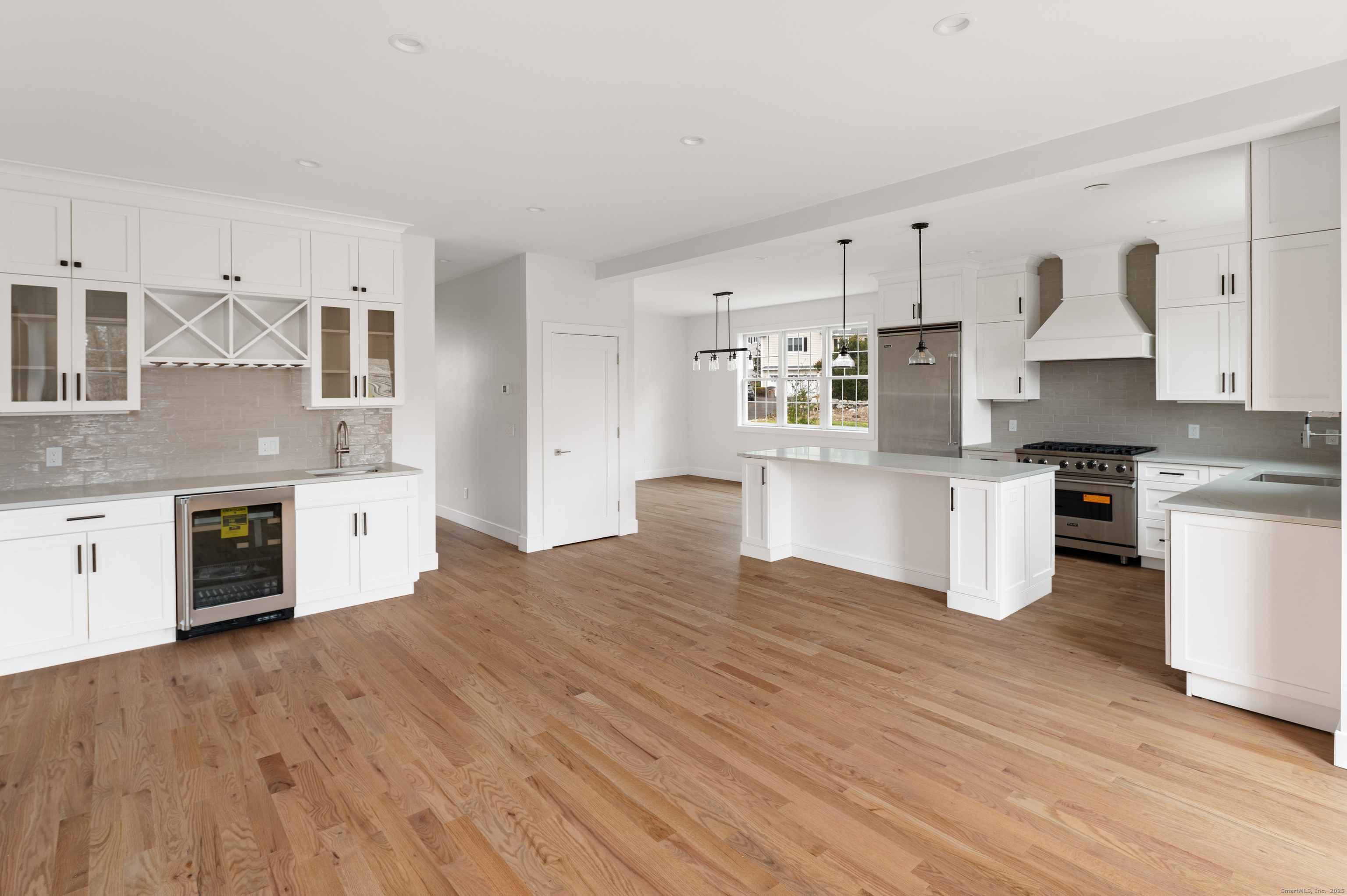 12 Walnut Ridge Court Stamford, CT 06905 - Photo 10 of 32 a kitchen with stainless steel appliances a white cabinets and stove top oven