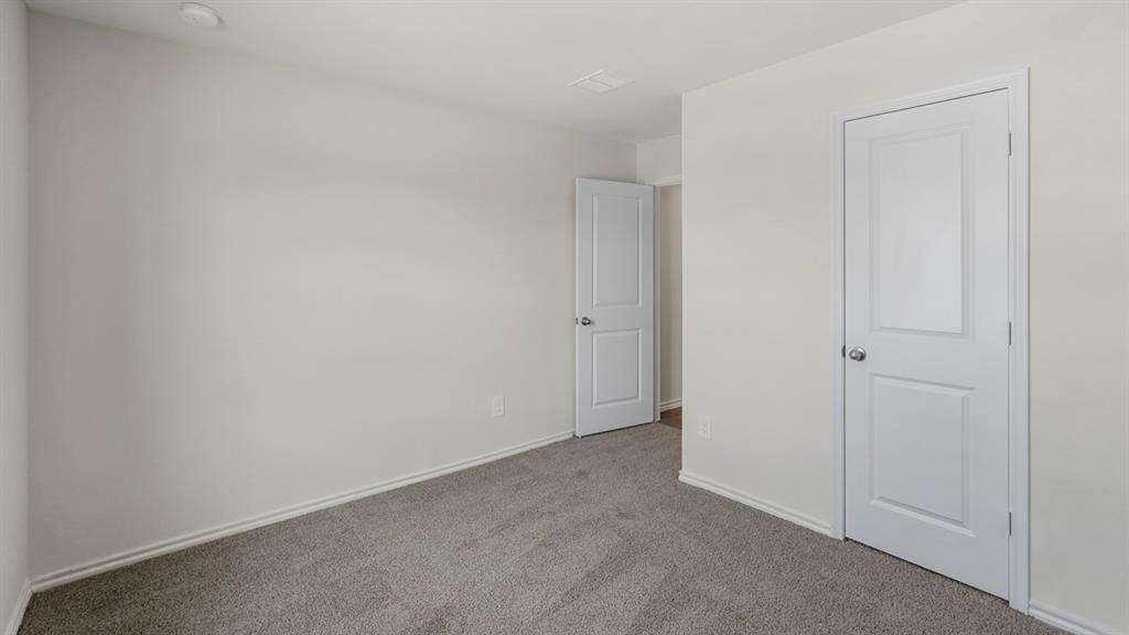 1969 Freeman Street Tyler, TX 75704 - Photo 19 of 30 Bedroom featuring light gray carpeting and white baseboards