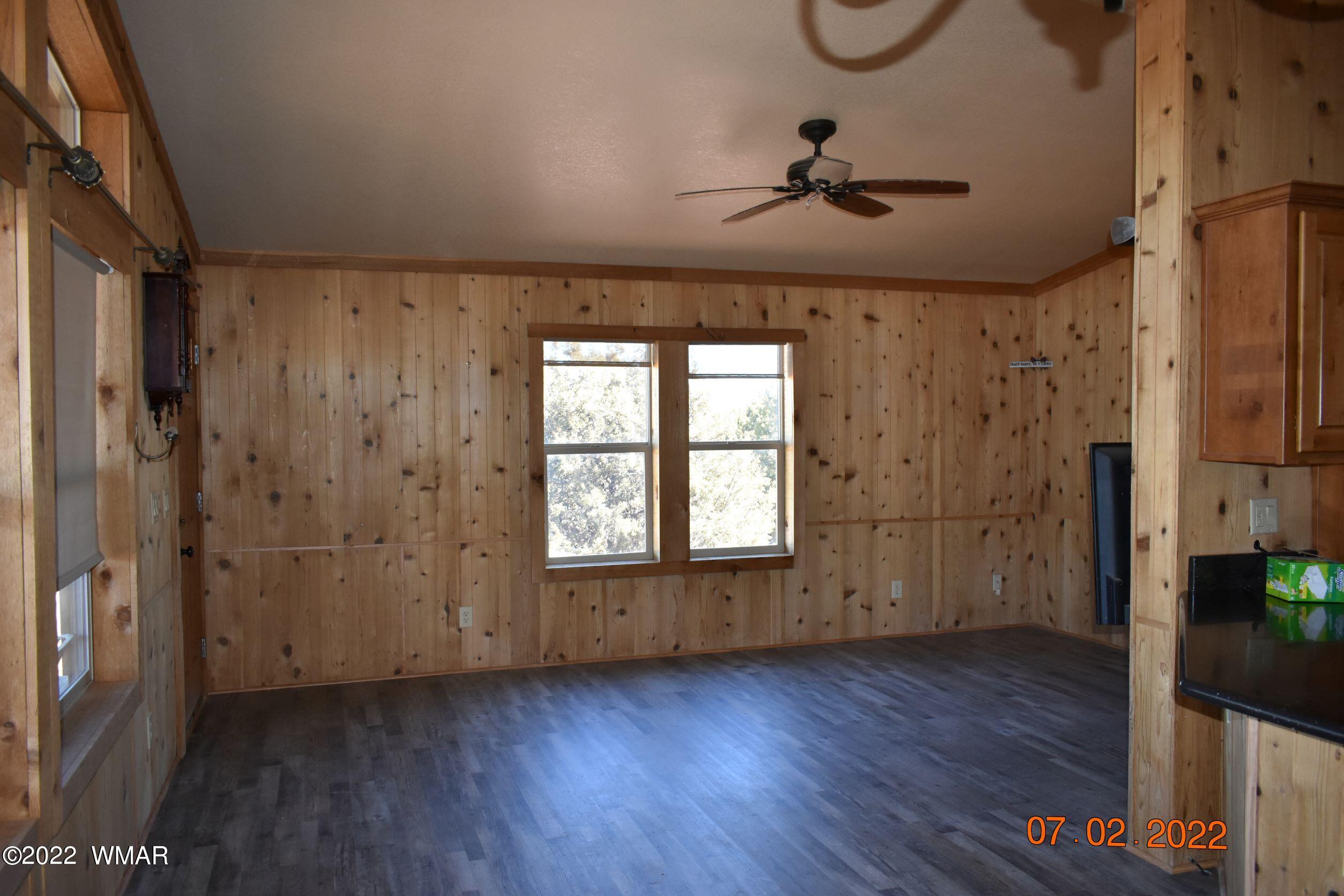 8 County Road 8309 Concho, AZ 85924 - Photo 14 of 45 wooden floor in an empty room with a window