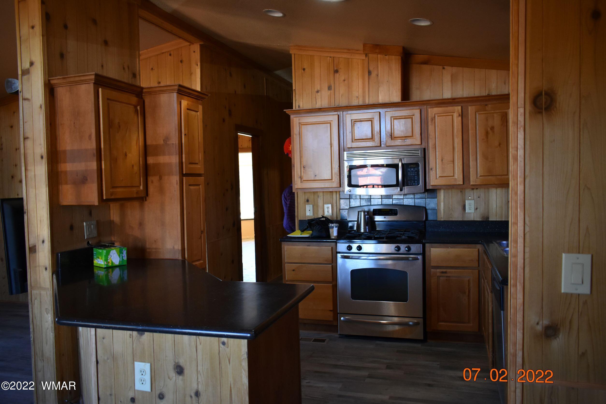 8 County Road 8309 Concho, AZ 85924 - Photo 15 of 45 a kitchen with stainless steel appliances granite countertop a refrigerator and a stove