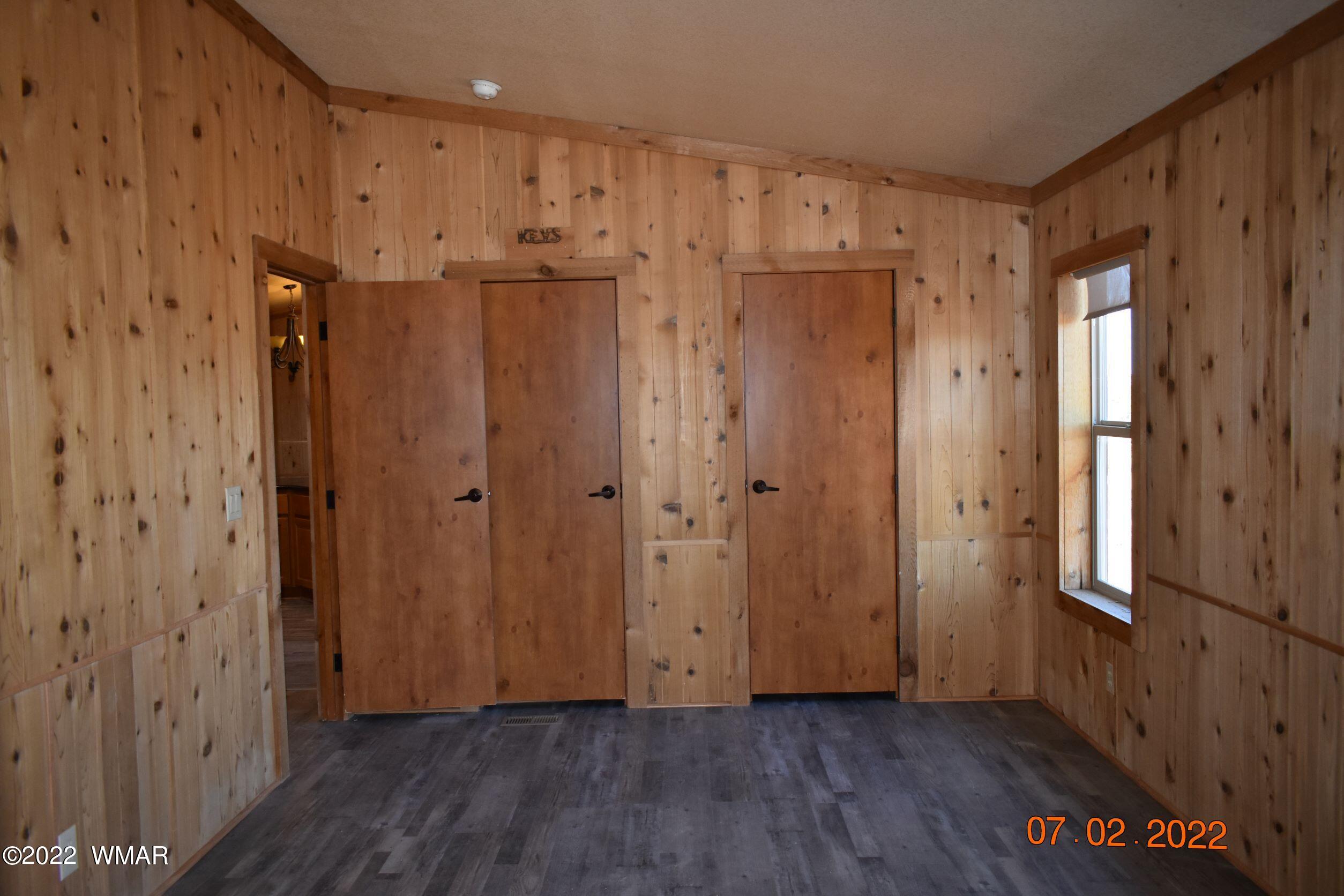 8 County Road 8309 Concho, AZ 85924 - Photo 19 of 45 a view of a hallway with wooden floor
