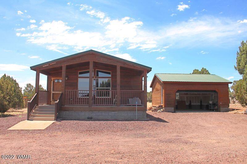8 County Road 8309 Concho, AZ 85924 - Photo 2 of 45 a front view of a house with a yard