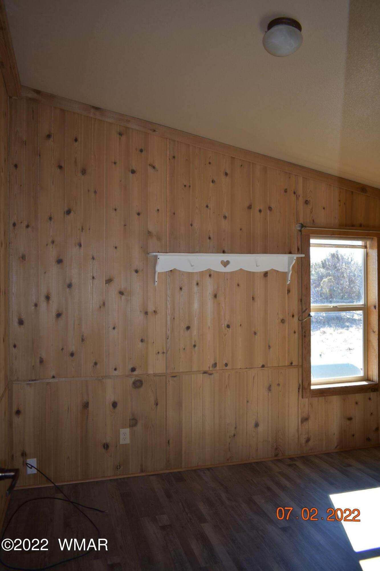 8 County Road 8309 Concho, AZ 85924 - Photo 24 of 45 a view of an empty room with wooden floor and a window