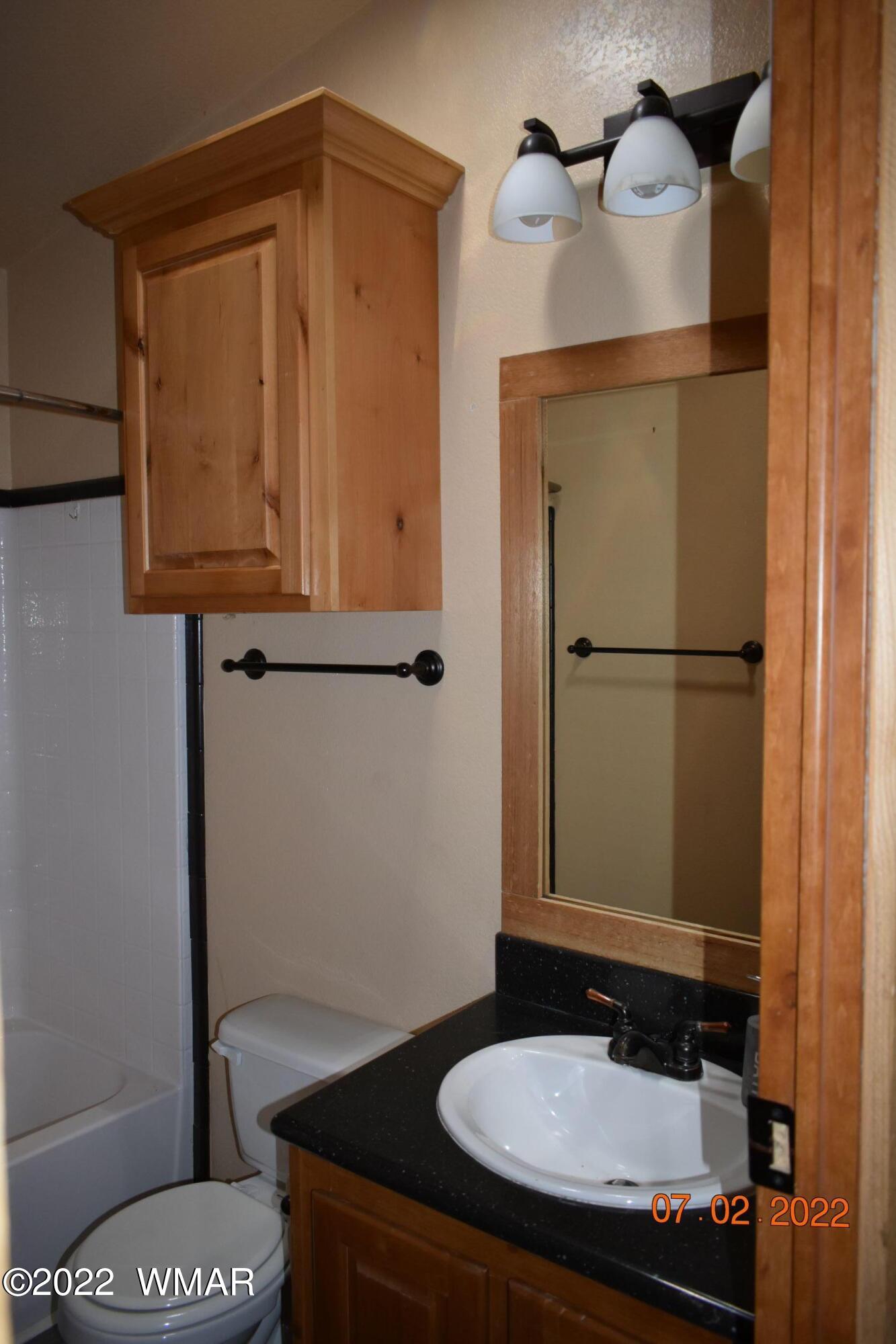 8 County Road 8309 Concho, AZ 85924 - Photo 26 of 45 a bathroom with a sink and a mirror