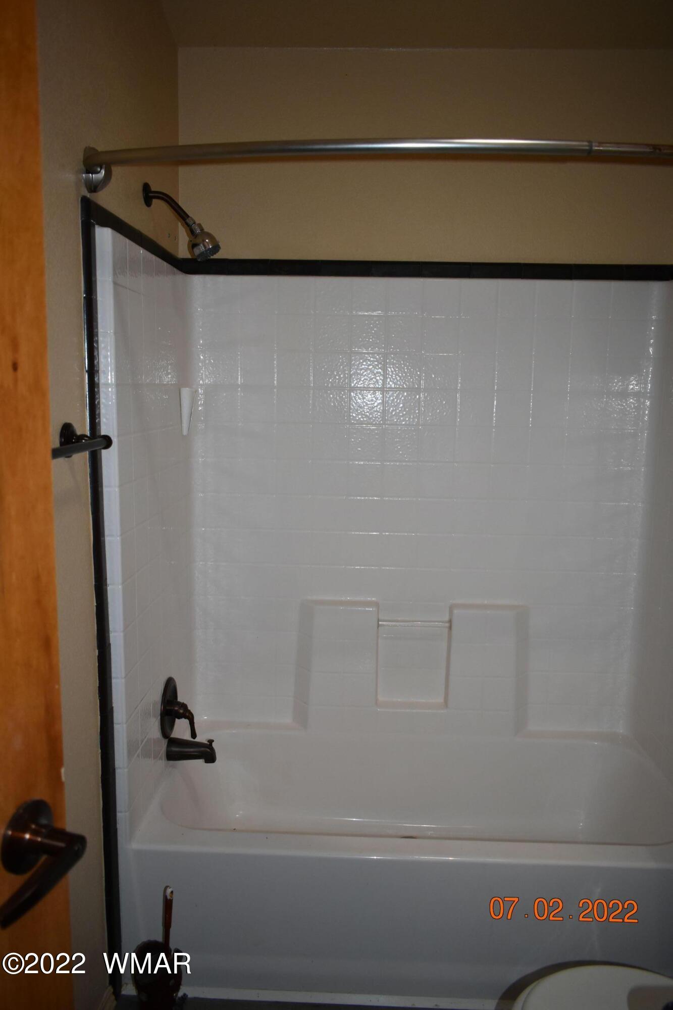 8 County Road 8309 Concho, AZ 85924 - Photo 27 of 45 a bathroom with a shower and a bath tub