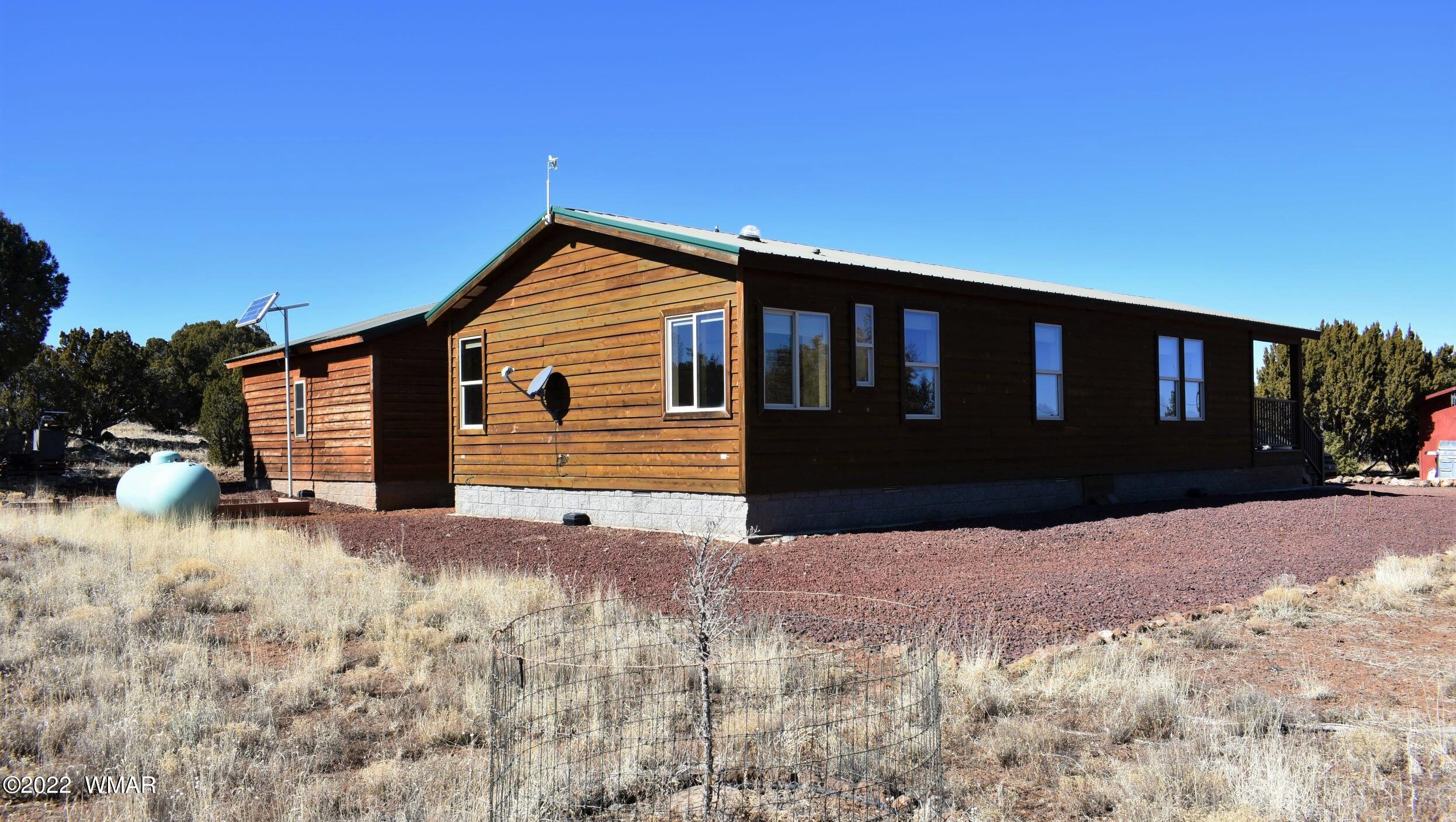 8 County Road 8309 Concho, AZ 85924 - Photo 34 of 45 a front view of a house with a yard