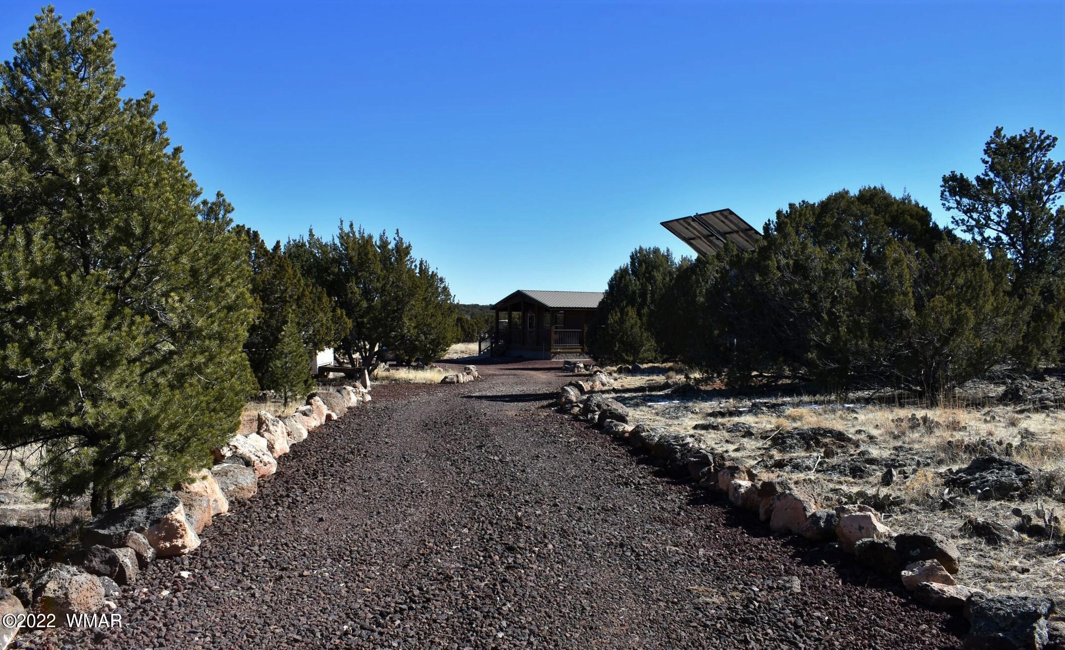 8 County Road 8309 Concho, AZ 85924 - Photo 7 of 45 a view of a backyard of a house