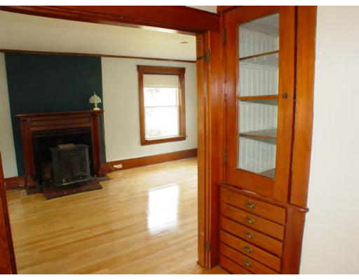 38 South Hampton Road Amesbury, MA 01913 - Photo 11 of 23 a view of an empty room with wooden floor and a fireplace
