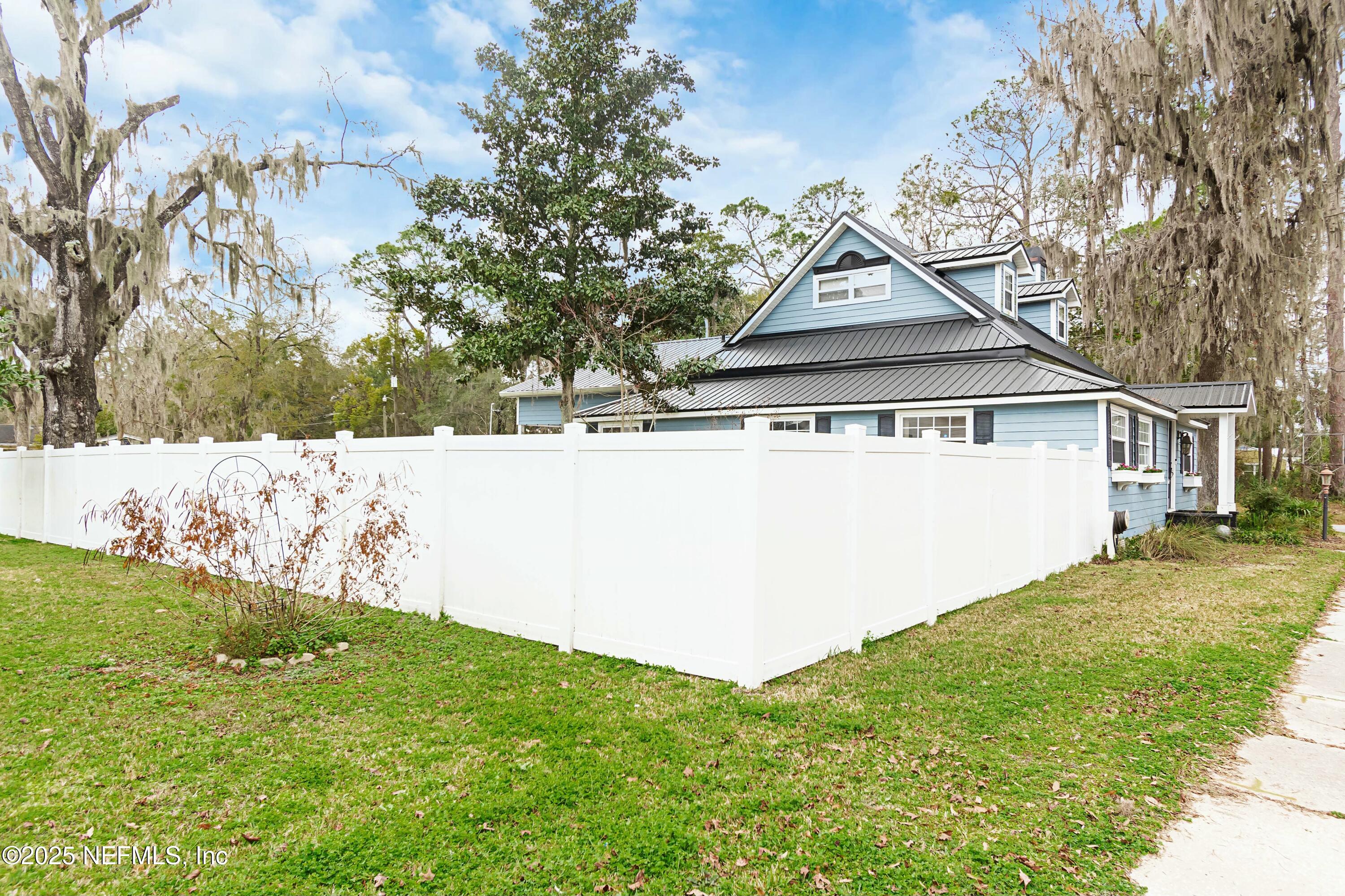 680 West Madison Street Starke, FL 32091 - Photo 16 of 22 a view of a yard in front of a house with large trees