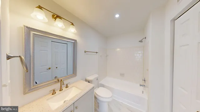 a bathroom with a double vanity sink mirror double and bathtub