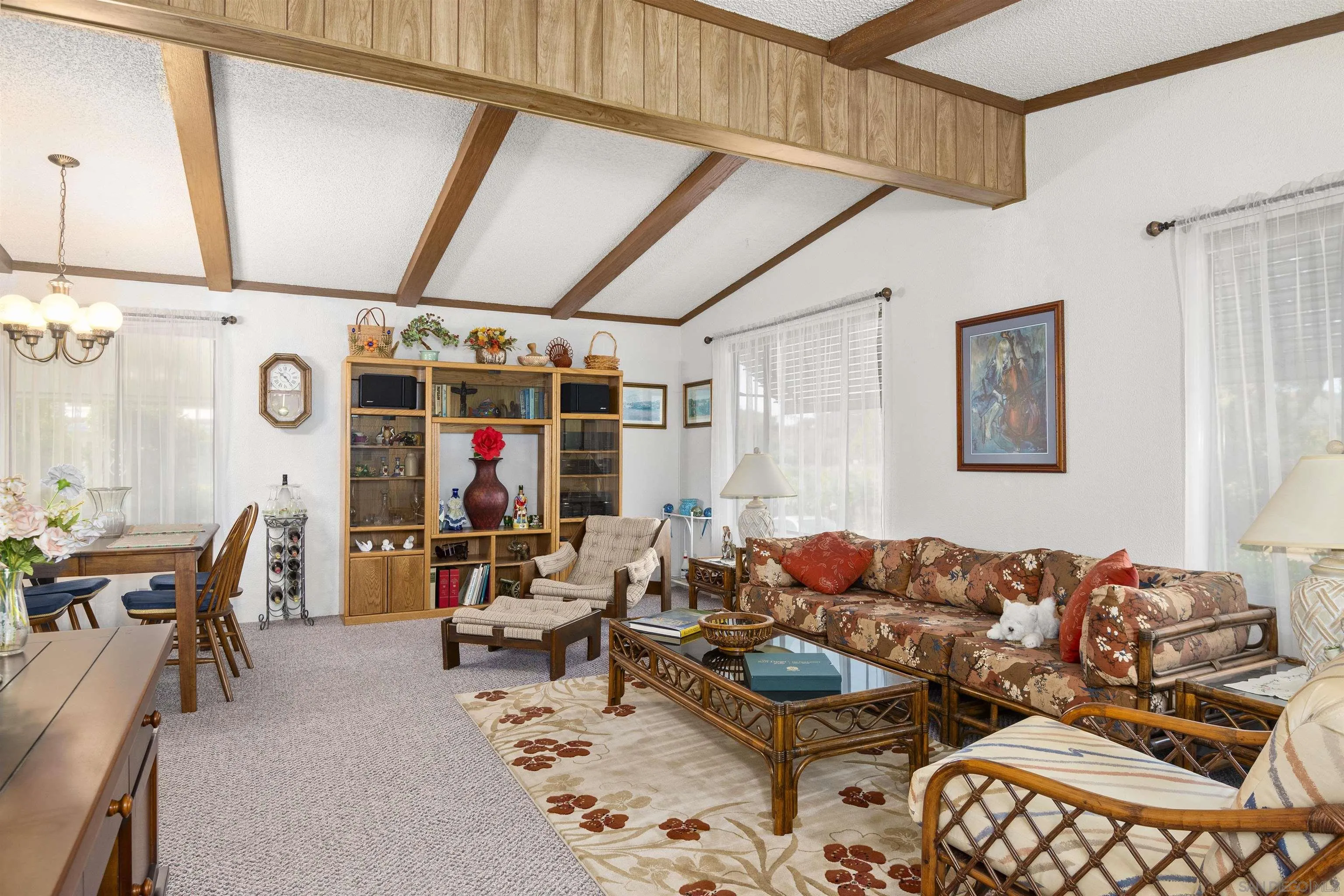 4747 Oak Crest Road, Unit 19 Fallbrook, CA 92028 - Photo 13 of 53 a living room with furniture a flat screen tv and a window
