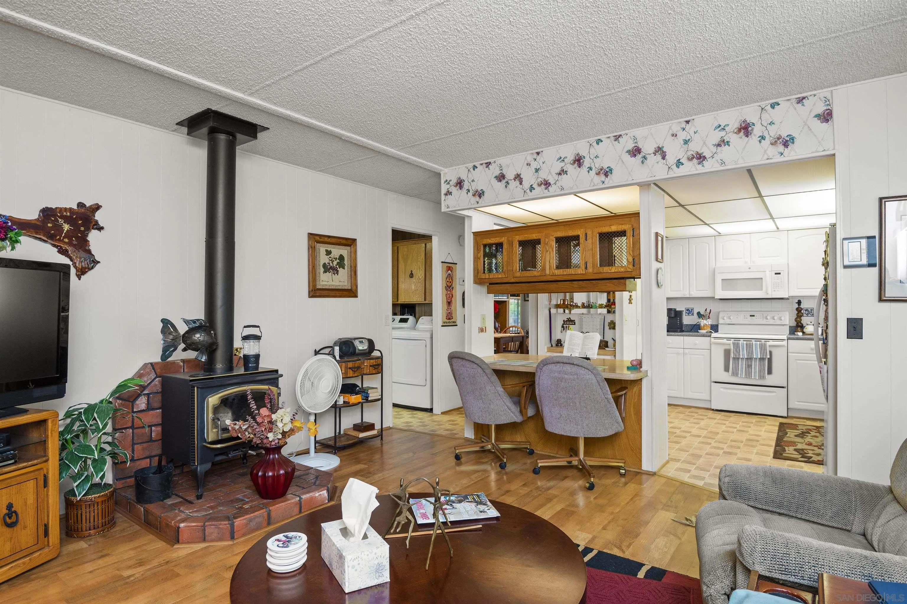 4747 Oak Crest Road, Unit 19 Fallbrook, CA 92028 - Photo 20 of 53 a living room with furniture a flat screen tv and a table