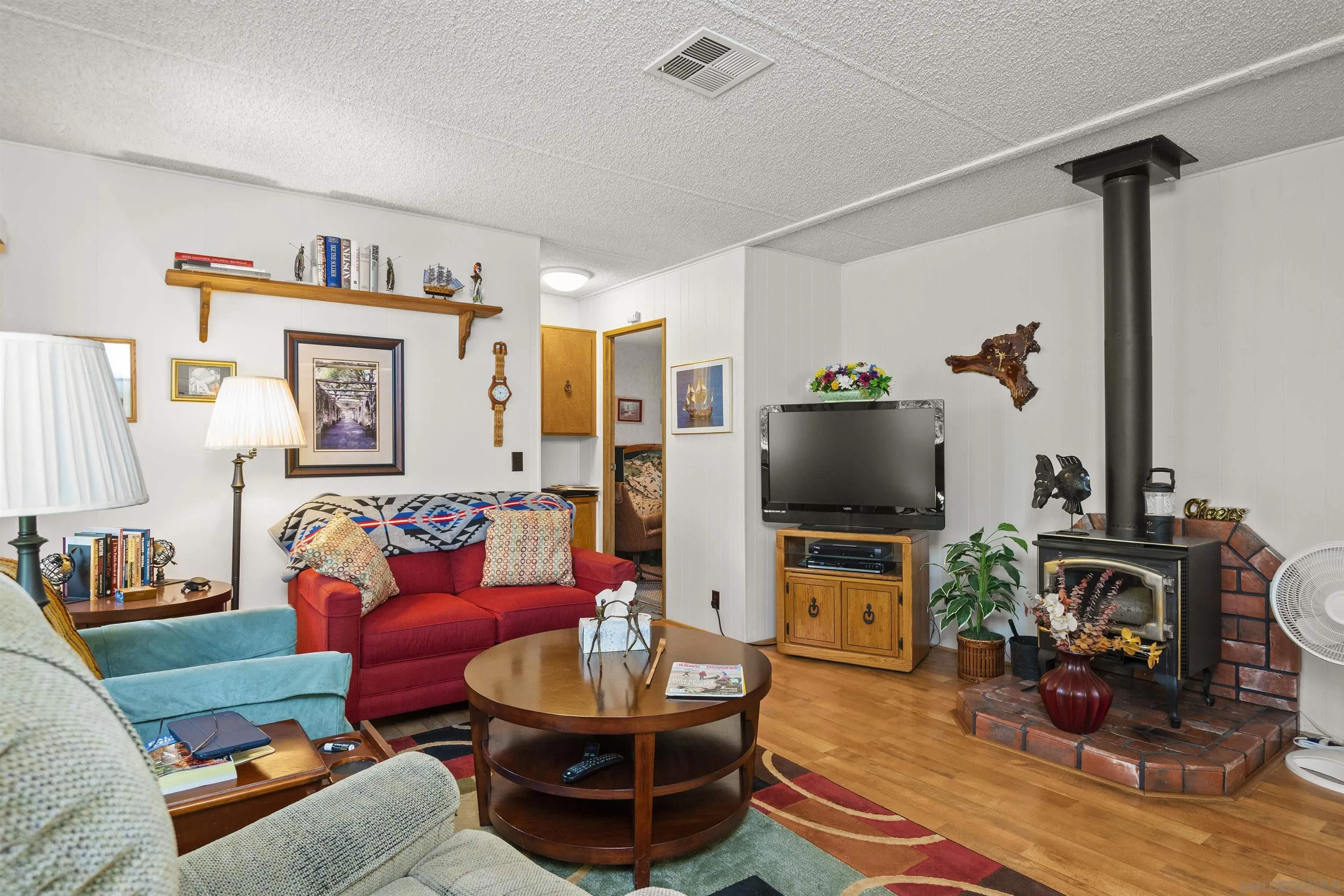 4747 Oak Crest Road, Unit 19 Fallbrook, CA 92028 - Photo 21 of 53 a living room with furniture and a flat screen tv